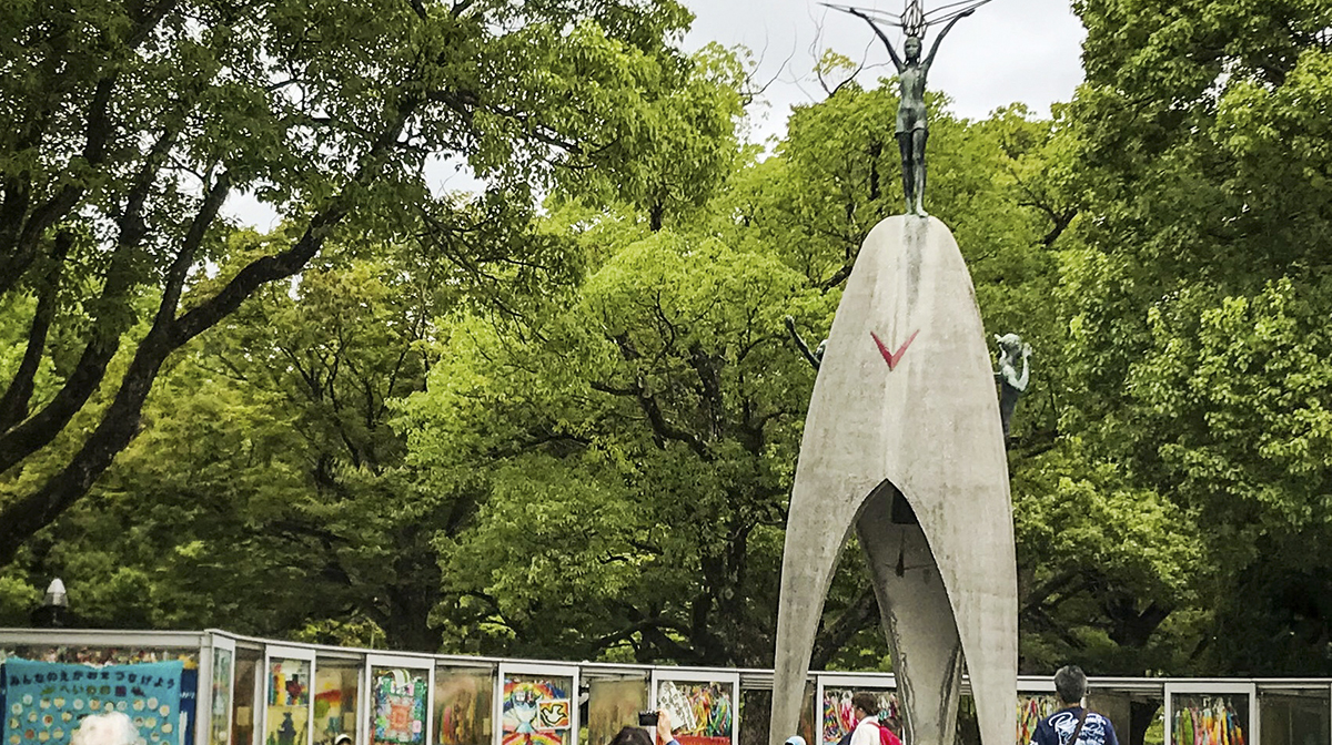 People walk towards the Peace Memorial in Hiroshima, Japan.